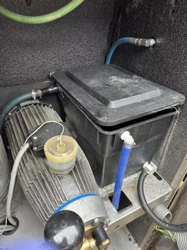 Original inlet water tank setup on a Nilfisk SH Truck prior to modification. The existing configuration was prone to inconsistent supply and required upgrading to improve flow stability and overall machine reliability.